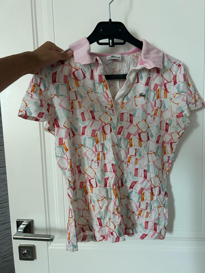 Розовое поло от Lacoste