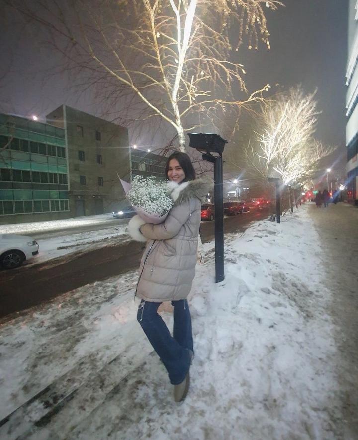 Женский пуховик с меховой отделкой