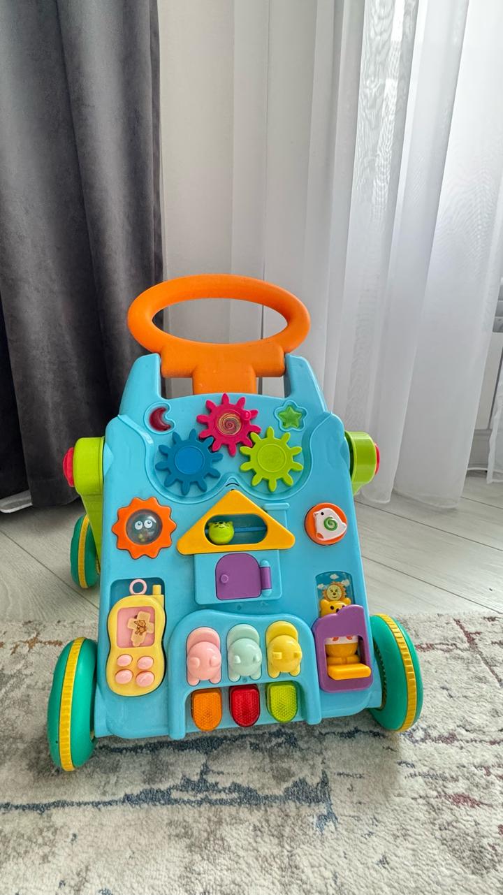 Детская каталка,  игровой центр