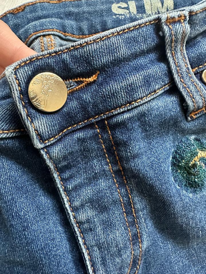 Джинсы Versace