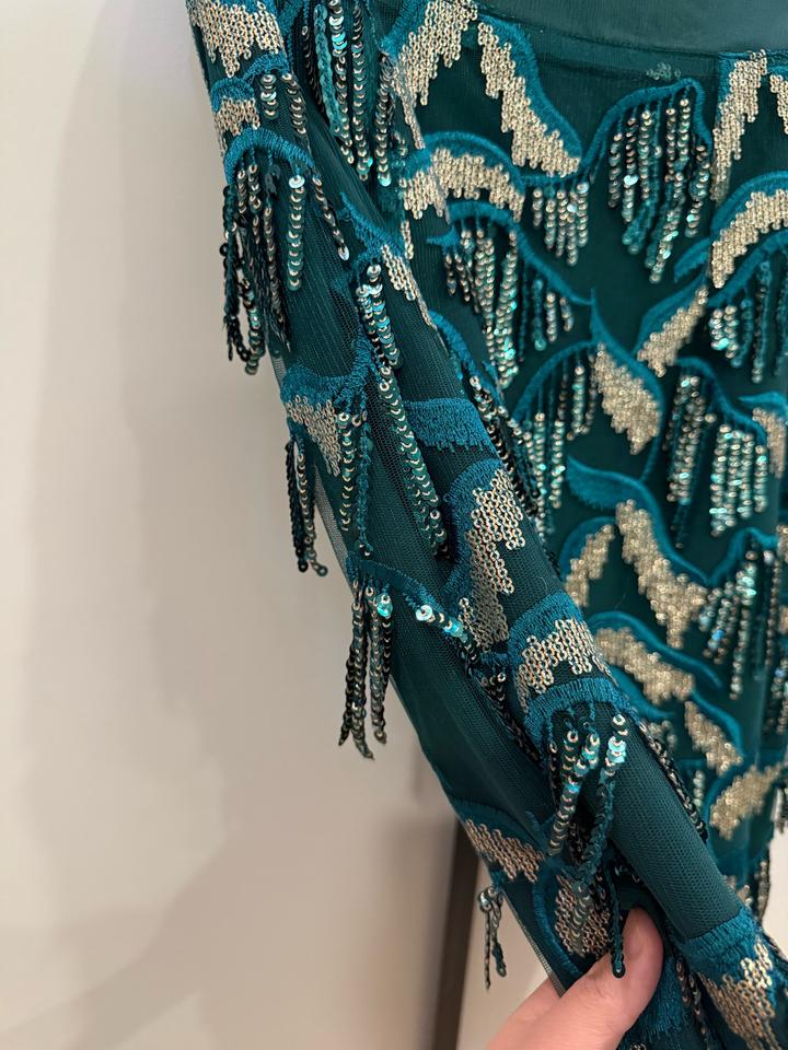 Изумрудная нарядная юбка с висюльками