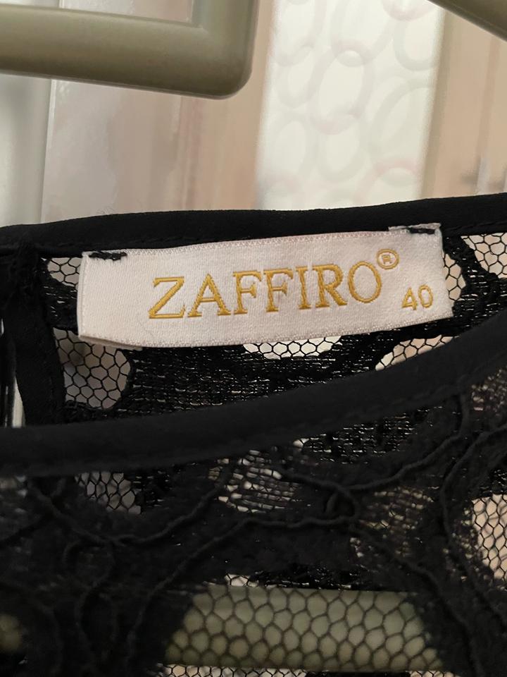 Блузка черная