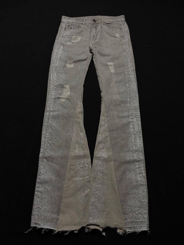 Custom distressed snake skin flared jeans