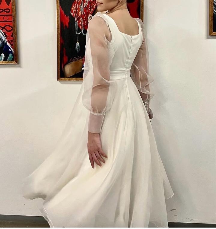 Белое платье от бренда Prima la sposa