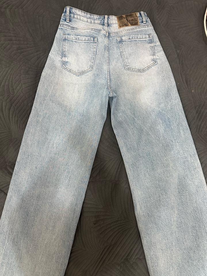 Джинсы новые