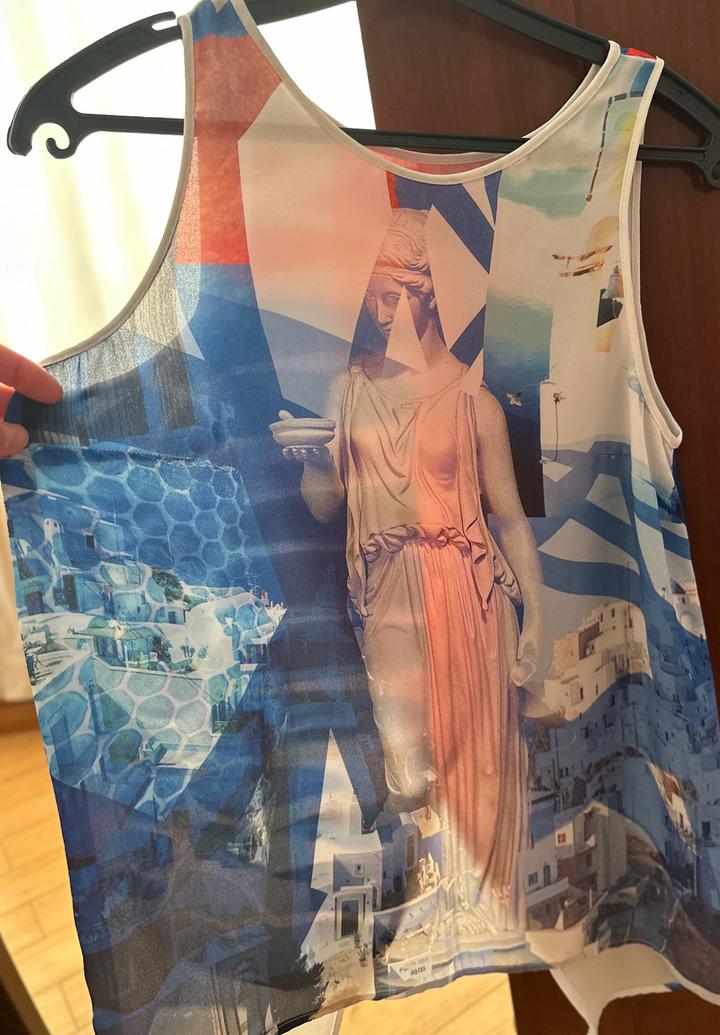 Блузка без рукавов