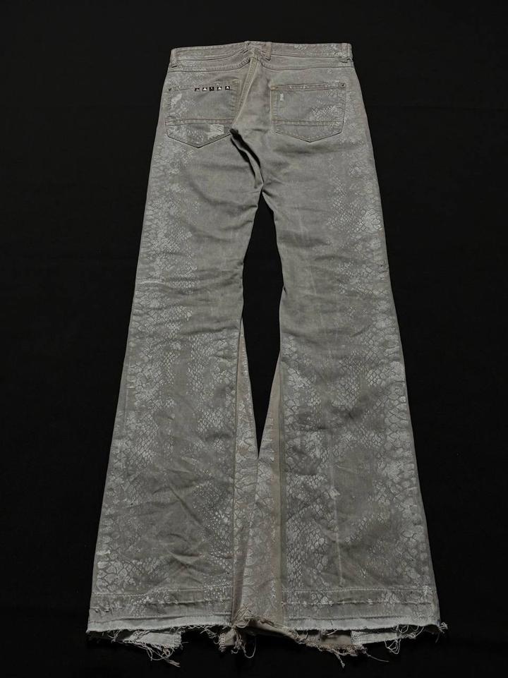 Custom distressed snake skin flared jeans