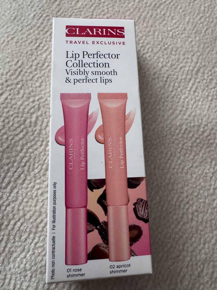 Блески для губ от Clarins в оттенке Rose shimmer,apricot shimmer