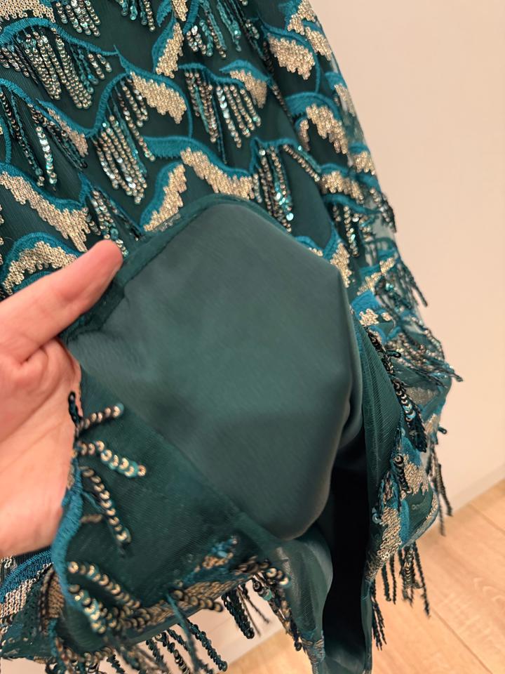 Изумрудная нарядная юбка с висюльками